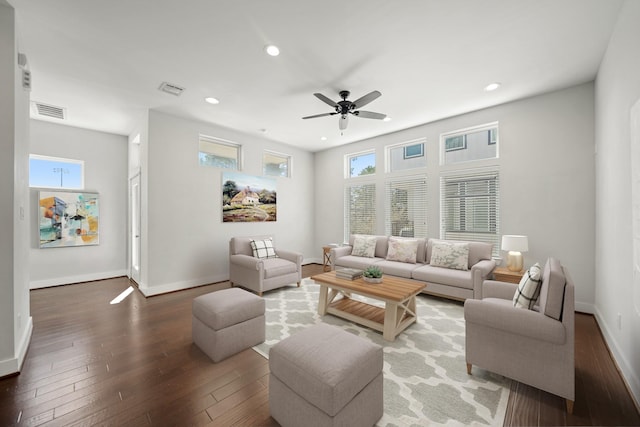 living area with visible vents, recessed lighting, baseboards, and wood-type flooring