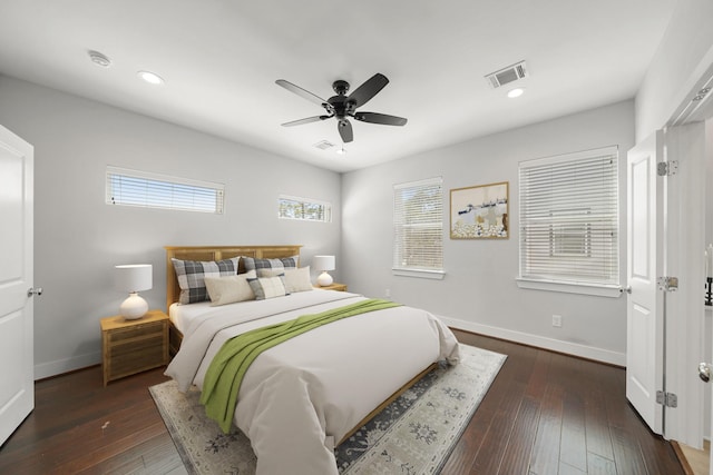 bedroom featuring dark wood-style floors, recessed lighting, and baseboards