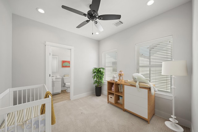 bedroom with recessed lighting, visible vents, baseboards, and a nursery area