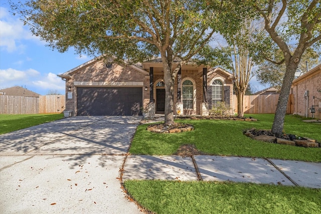 ranch-style house with brick siding, an attached garage, concrete driveway, and a front yard