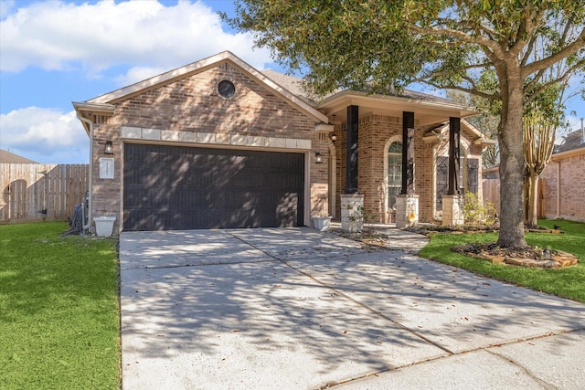 ranch-style house featuring driveway, a front lawn, fence, a garage, and brick siding