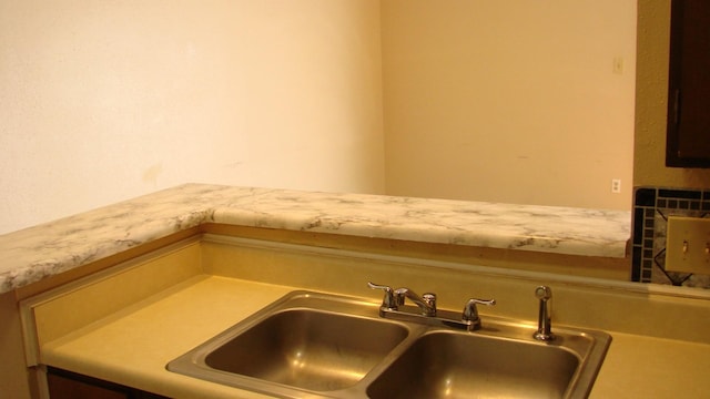 room details featuring a sink and light countertops