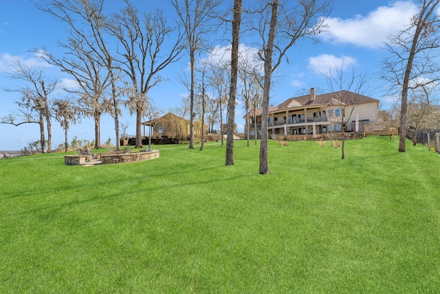 view of yard featuring fence and a wooden deck