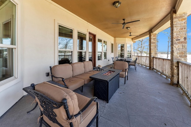 view of patio featuring an outdoor living space with a fire pit and ceiling fan