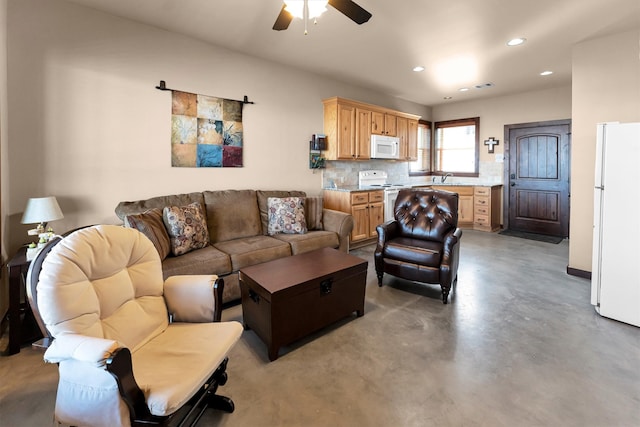 living room with recessed lighting, visible vents, finished concrete flooring, and ceiling fan