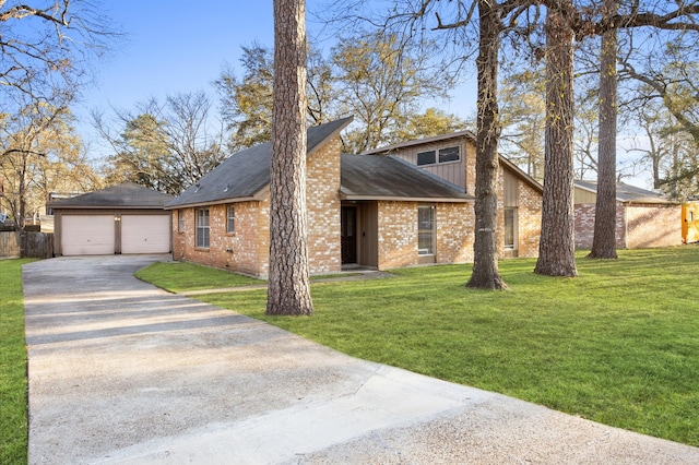 mid-century home featuring brick siding, concrete driveway, an outbuilding, and fence