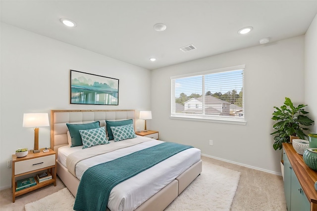 bedroom featuring light carpet, visible vents, recessed lighting, and baseboards