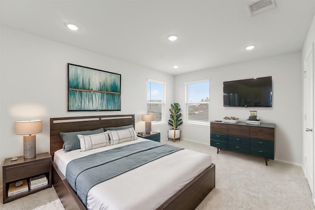 bedroom with baseboards, recessed lighting, visible vents, and light carpet