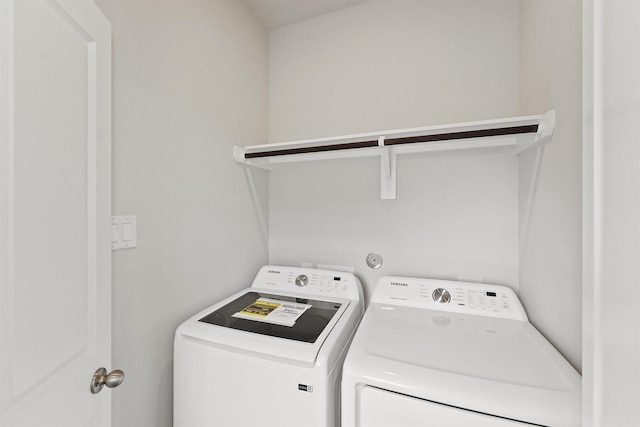 washroom featuring laundry area and washer and dryer