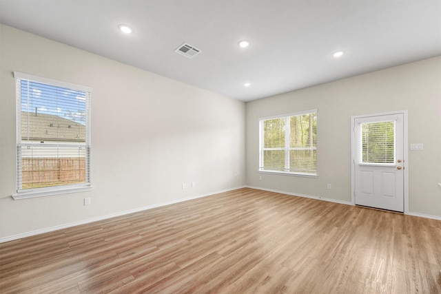 spare room featuring recessed lighting, visible vents, baseboards, and light wood finished floors