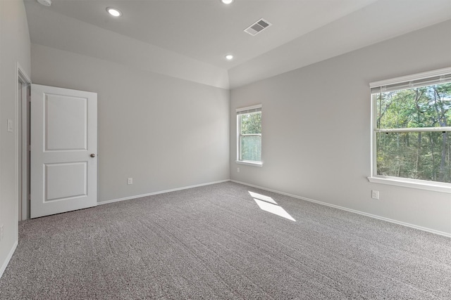 spare room featuring recessed lighting, visible vents, baseboards, and carpet flooring