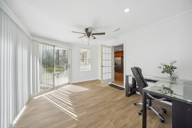 office space featuring visible vents, baseboards, recessed lighting, light wood-style flooring, and a ceiling fan