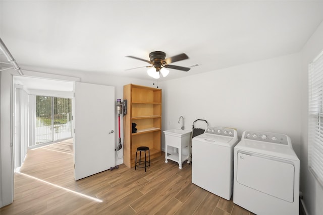 laundry area featuring wood finished floors, visible vents, laundry area, separate washer and dryer, and ceiling fan