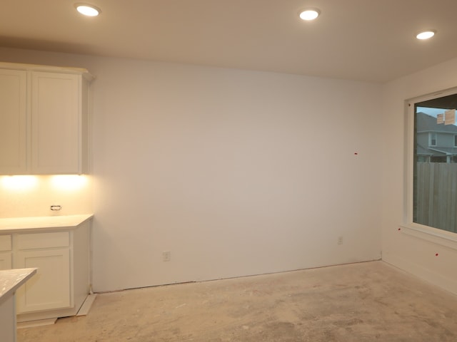 8518 Pier Cove Dr, Cypress, TX 77433 - unfurnished dining area with recessed lighting and concrete floors