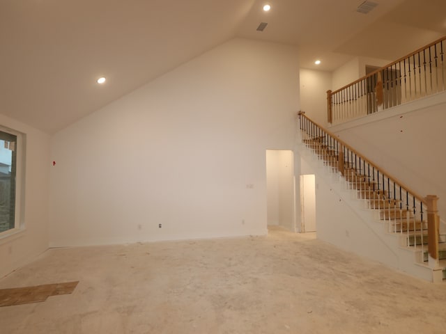 8518 Pier Cove Dr, Cypress, TX 77433 - unfurnished living room featuring high vaulted ceiling, stairway, and recessed lighting