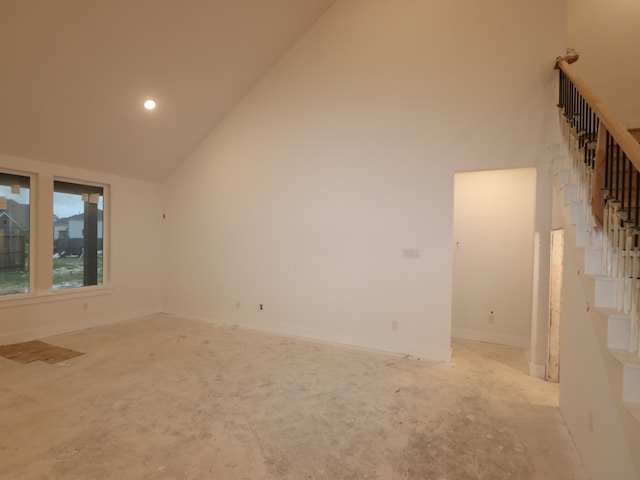 8518 Pier Cove Dr, Cypress, TX 77433 - spare room featuring high vaulted ceiling and stairs