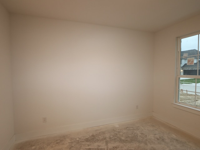 8518 Pier Cove Dr, Cypress, TX 77433 - unfurnished room with baseboards and concrete floors
