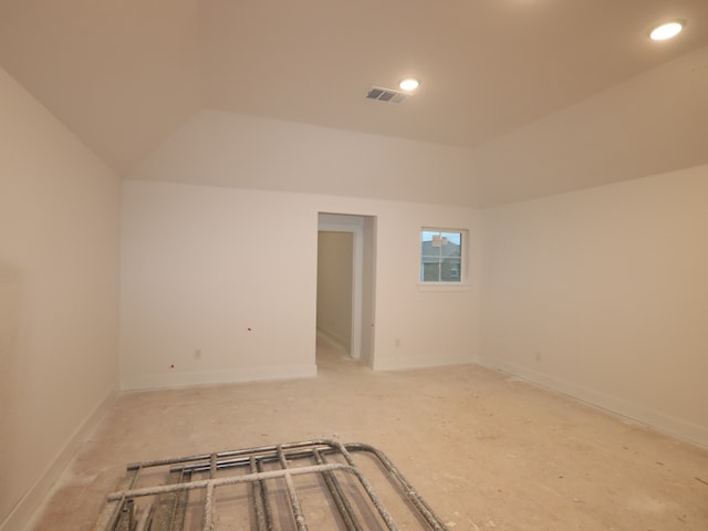 8518 Pier Cove Dr, Cypress, TX 77433 - empty room featuring vaulted ceiling and recessed lighting