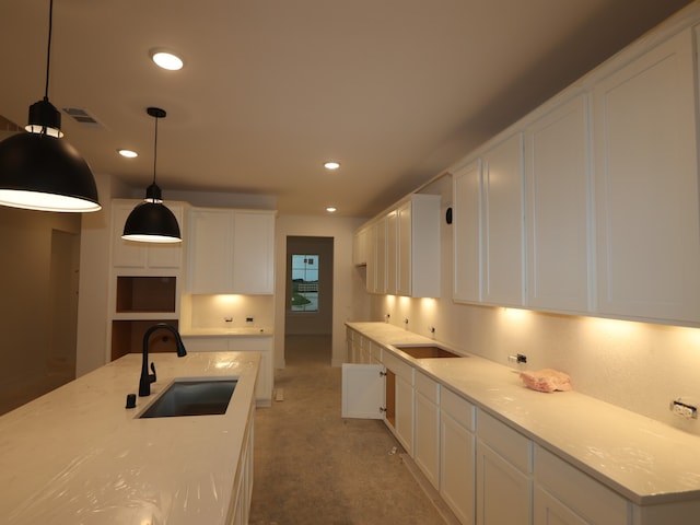 8518 Pier Cove Dr, Cypress, TX 77433 - kitchen featuring white cabinetry, recessed lighting, light carpet, pendant lighting, and light countertops