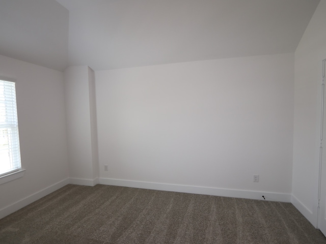 8518 Pier Cove Dr, Cypress, TX 77433 - empty room featuring carpet floors and vaulted ceiling