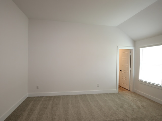8518 Pier Cove Dr, Cypress, TX 77433 - spare room featuring light colored carpet and lofted ceiling