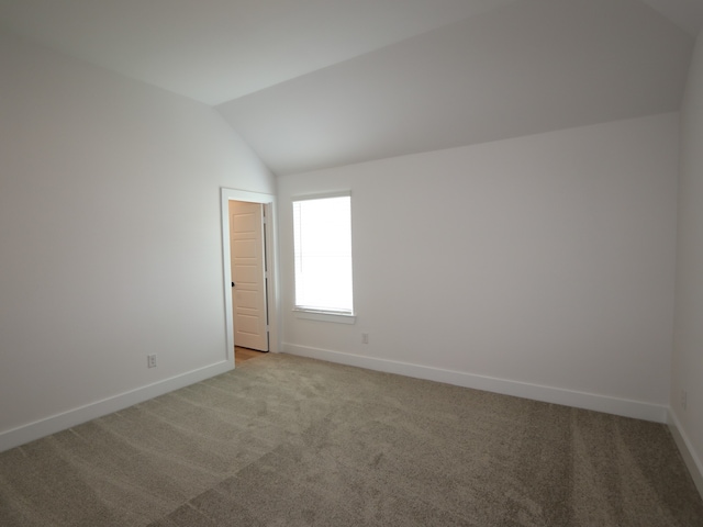 8518 Pier Cove Dr, Cypress, TX 77433 - spare room featuring light colored carpet and vaulted ceiling