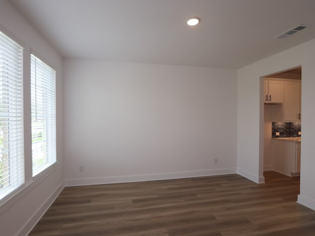 8518 Pier Cove Dr, Cypress, TX 77433 - empty room featuring dark wood finished floors and recessed lighting