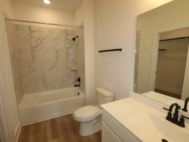 8518 Pier Cove Dr, Cypress, TX 77433 - bathroom featuring wood finished floors, bathtub / shower combination, vanity, a spacious closet, and recessed lighting