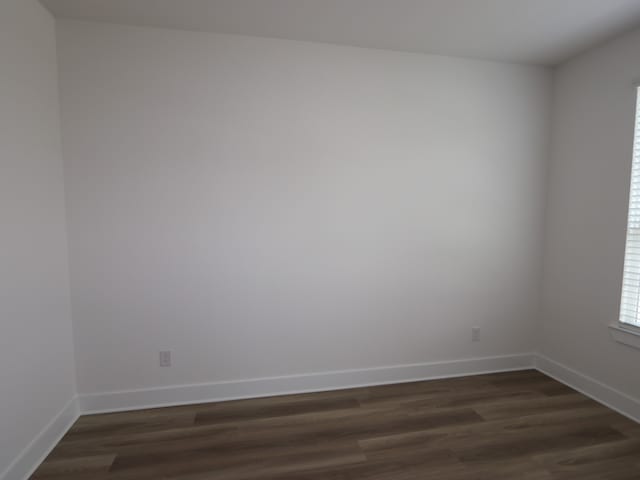 8518 Pier Cove Dr, Cypress, TX 77433 - spare room with dark wood-style flooring