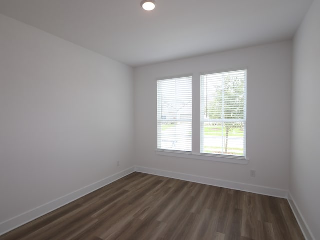 8518 Pier Cove Dr, Cypress, TX 77433 - empty room with baseboards and dark wood-type flooring