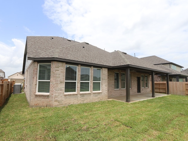 8518 Pier Cove Dr, Cypress, TX 77433 - back of house with a shingled roof, a patio area, and a fenced backyard