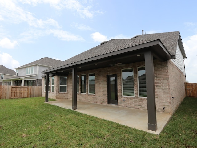 8518 Pier Cove Dr, Cypress, TX 77433 - back of house featuring brick siding, roof with shingles, ceiling fan, and a patio area