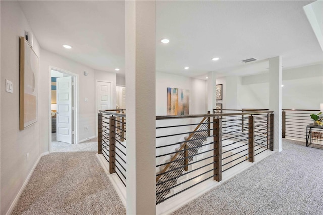 corridor featuring recessed lighting, an upstairs landing, carpet, and visible vents