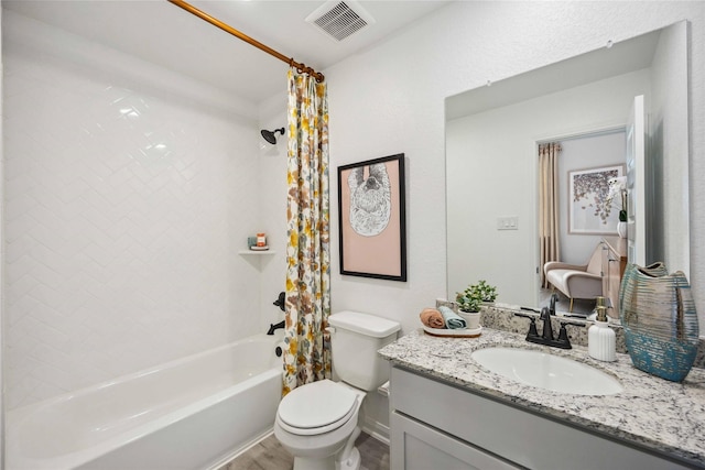 bathroom with vanity, toilet, shower / bath combo, and visible vents