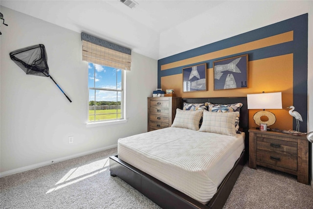 carpeted bedroom with visible vents and baseboards