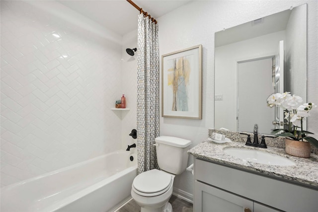 bathroom with visible vents, toilet, vanity, and shower / bath combo