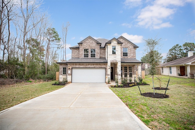 french country home with brick siding, a garage, concrete driveway, and a front lawn