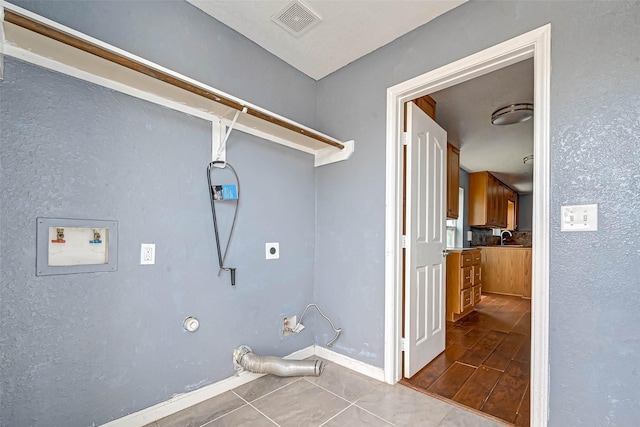 clothes washing area with visible vents, washer hookup, hookup for a gas dryer, hookup for an electric dryer, and laundry area