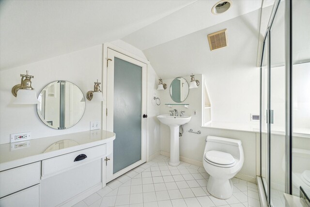 bathroom featuring baseboards, visible vents, lofted ceiling, a shower stall, and toilet