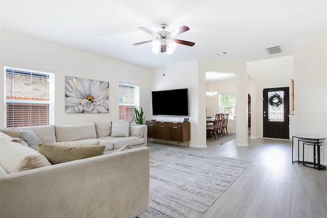 4918 Seaside Sparrow Ln, Baytown, TX 77521 - living room with a wealth of natural light, visible vents, and light wood finished floors
