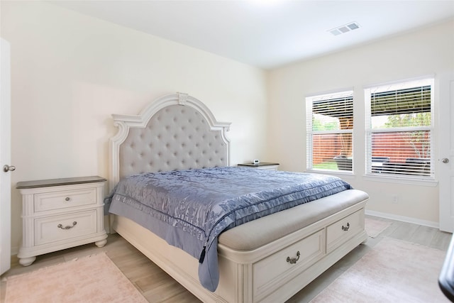 4918 Seaside Sparrow Ln, Baytown, TX 77521 - bedroom featuring baseboards, visible vents, and light wood-type flooring