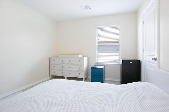 4918 Seaside Sparrow Ln, Baytown, TX 77521 - bedroom featuring visible vents and baseboards
