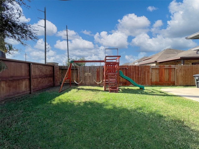 4918 Seaside Sparrow Ln, Baytown, TX 77521 - view of playground featuring a yard and a fenced backyard