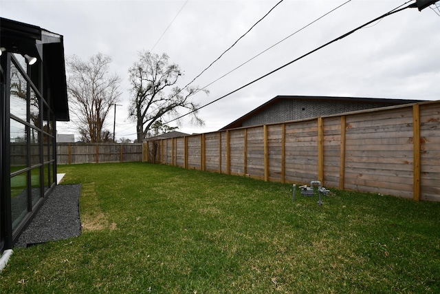 view of yard featuring a fenced backyard