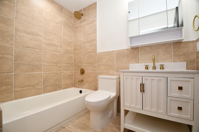 bathroom with vanity, shower / bathing tub combination, tile patterned flooring, tile walls, and toilet