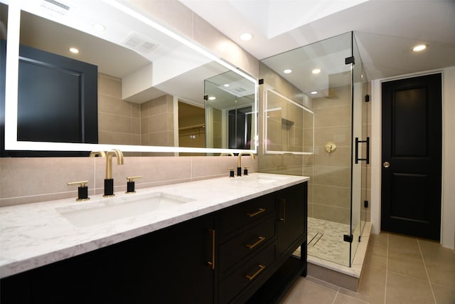 full bath featuring double vanity, visible vents, and a sink