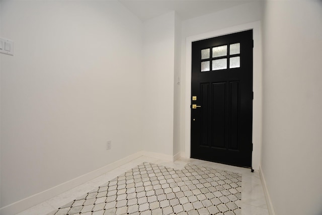 foyer featuring baseboards