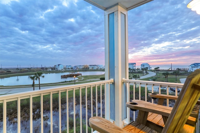 balcony featuring a water view