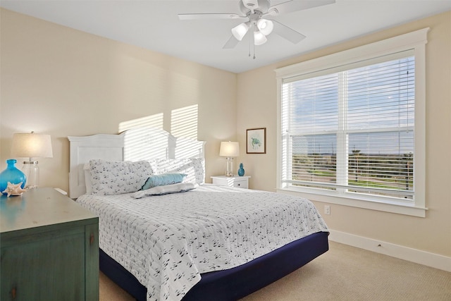 bedroom featuring carpet flooring, baseboards, and ceiling fan