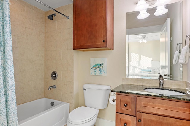 bathroom with shower / bath combination with curtain, toilet, vanity, and ceiling fan